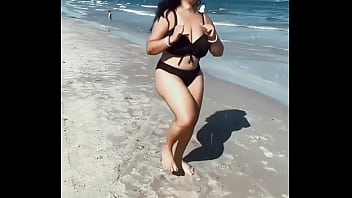 Hot woman at beach in bikini